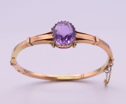 A 19th century Russian 14 ct gold and amethyst bangle. 5.5 cm internal width. 11.