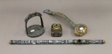 Four pieces of Chinese cloisonne, including a stirrup, a pipe, a ruyi sceptre and a small burner.