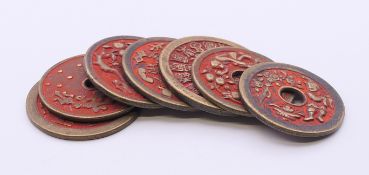 Seven Chinese roundels. The largest 4.5 cm diameter.