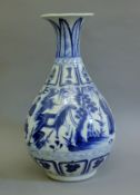 A large Chinese blue and white porcelain vase decorated with figures. 45 cm high.