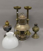 A quantity of various lamps and candlesticks. The largest 51 cm high.