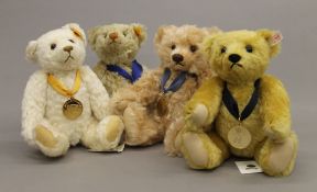 Four Steiff teddy bears, each housed in a Steiff display case - 2004 Bear of the Year,