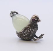 A silver bird and egg form pendant bearing Russian marks. 2.5 cm high.