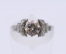 An Art Deco 18 ct white gold diamond ring. Ring size J/K. 3 grammes total weight.