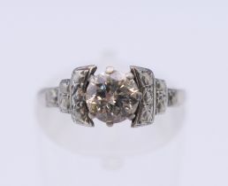 An Art Deco 18 ct white gold diamond ring. Ring size J/K. 3 grammes total weight.