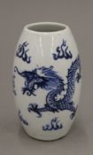 A small Chinese blue and white porcelain vase decorated with four claw dragon,