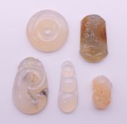 Five hardstone pendants. The largest 4.5 cm long.