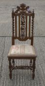 A single 19th century carved oak chair.