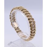 A 9 ct gold bracelet for twisted form. 19 cm long. 22.5 grammes.