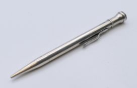 A silver propelling pencil, hallmarked Birmingham 1932. 12 cm long.