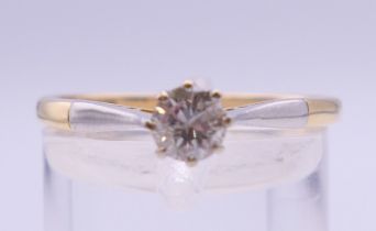 An 18 ct gold and platinum 0.25 carat diamond solitaire ring. Ring size Q/R. 2.