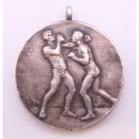 A Rock of Gibralter Boxing silver medal. 3 cm diameter.