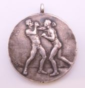 A Rock of Gibralter Boxing silver medal. 3 cm diameter.