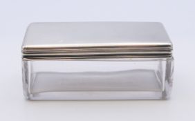 An early Victorian silver lidded glass vanity box, hallmarked London 1839. 9 cm long.