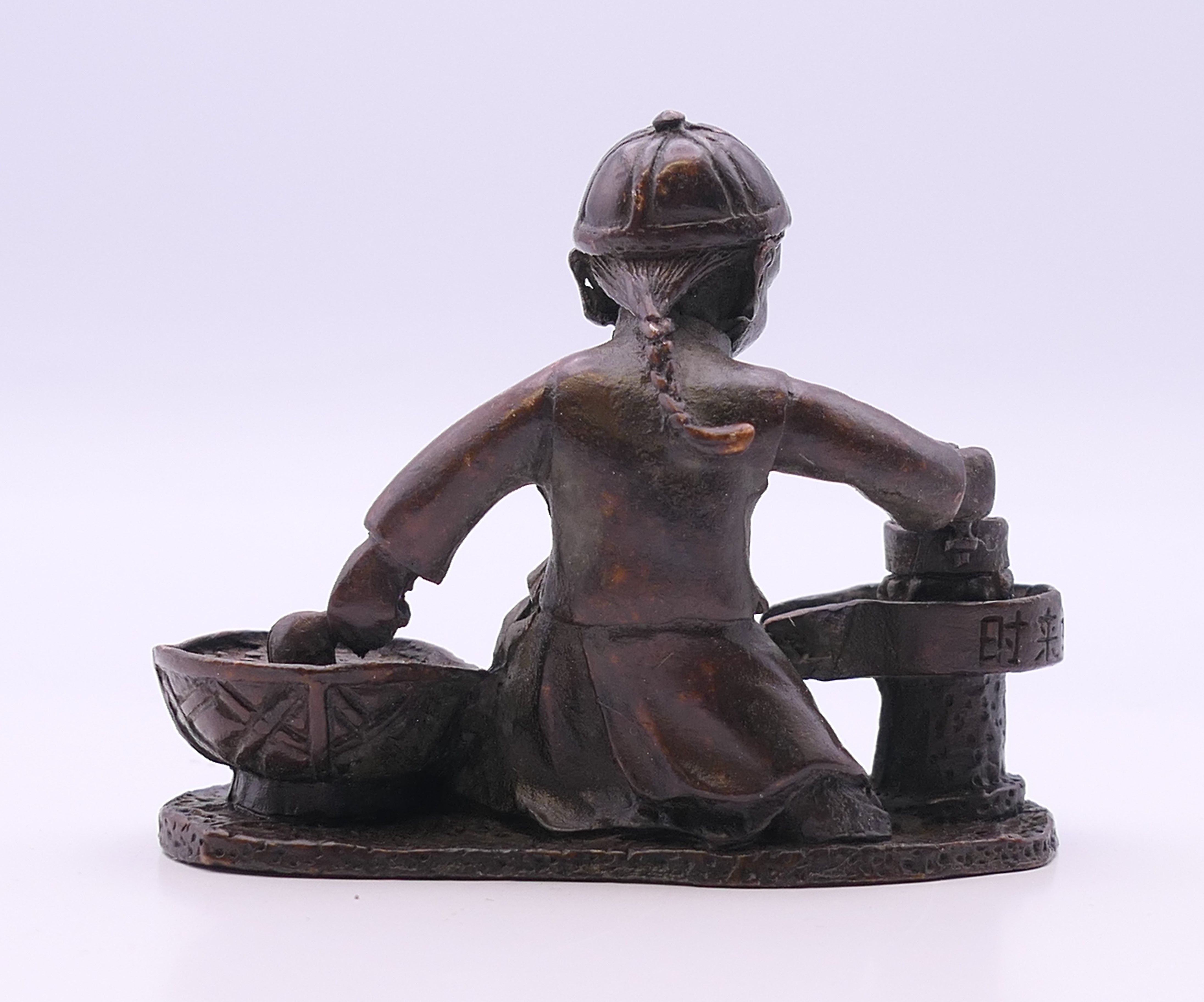A bronze model of a boy cooking. 6 cm high. - Image 3 of 4