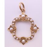 A Victorian 15 ct gold seed pearl pendant. 2.5 cm high.