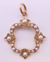 A Victorian 15 ct gold seed pearl pendant. 2.5 cm high.