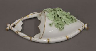 A Victorian florally encrusted porcelain wall pocket. 33.5 cm high.
