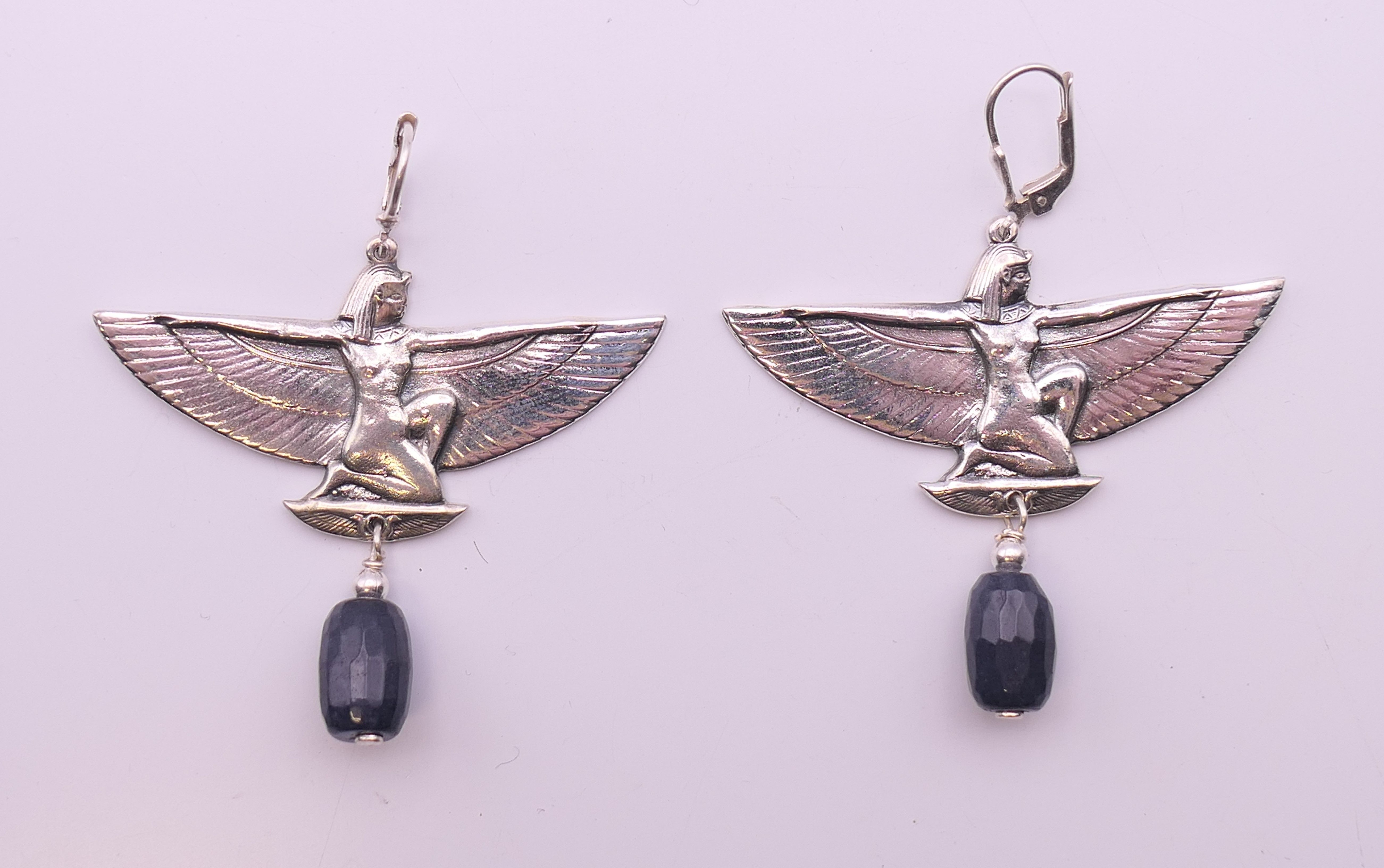 A pair of Egyptian Revival earrings. 5 cm wide.