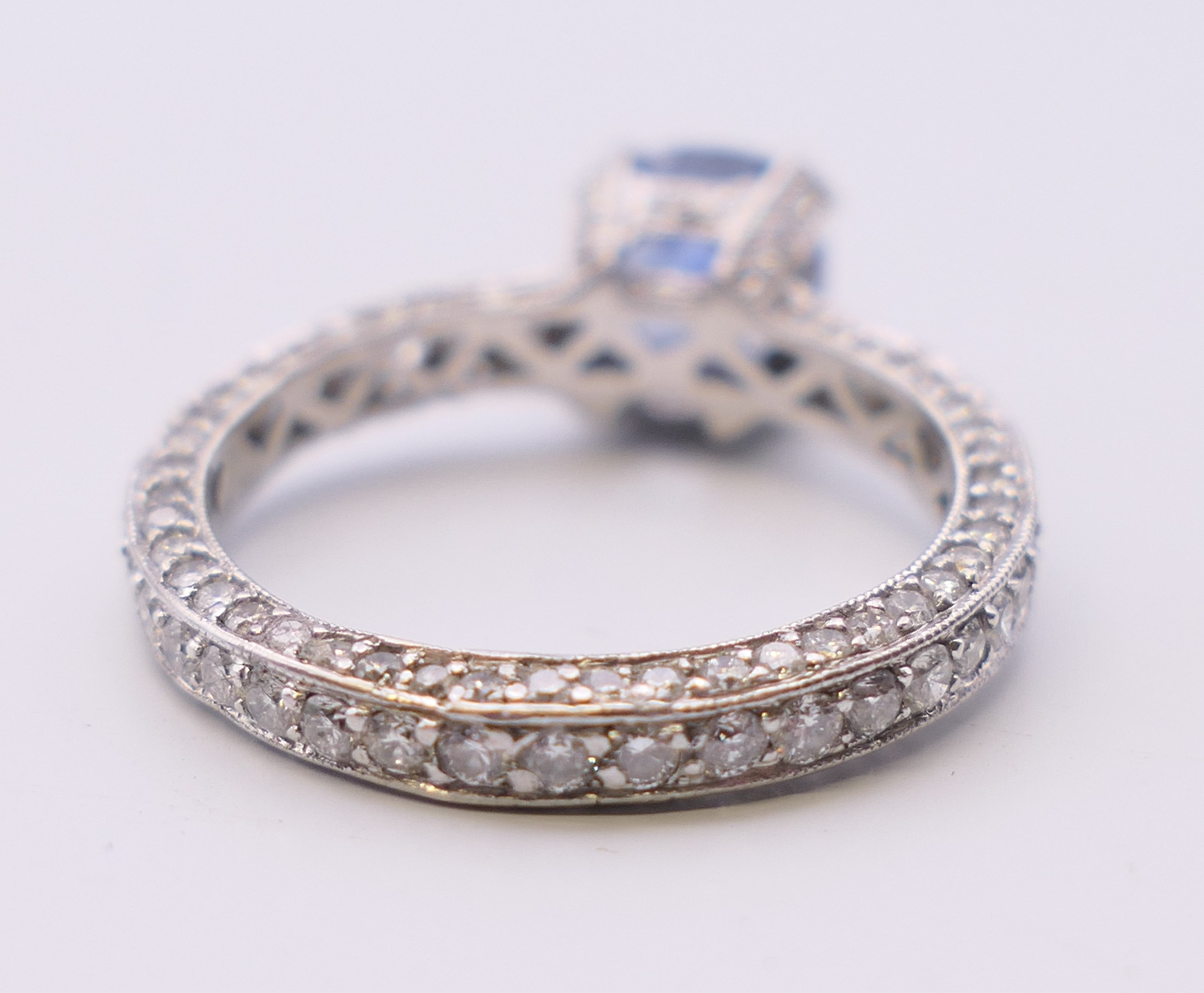 An 18 ct gold sapphire and diamond ring. Total diamond weight approximately 2.5 carats. - Image 10 of 11