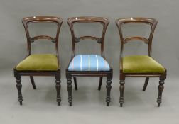 A Lloyd Loom chair and three 19th century mahogany chairs. The former 52 cm wide.