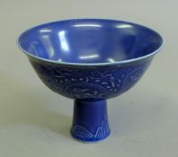 A Chinese blue porcelain stem cup. 10 cm high.