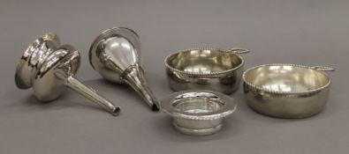 Two silver plated wine funnels and two silver plated tasting cups. The largest 15.5 cm.