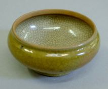 An 18th century Chinese green crackle glaze bowl. 10 cm diameter.