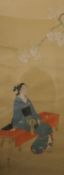 A Chinese scroll painting depicting a Female Figure Beneath Prunus Blossom, framed and glazed. 57.