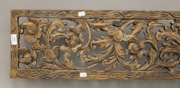 An Eastern florally carved panel. 183 cm long.