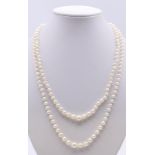 A two strand pearl necklace with a 9 ct gold clasp. 43 cm long.