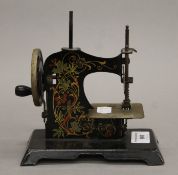 A child's sewing machine. 15.5 cm long.