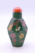 A Chinese green glass snuff bottle. 6.5 cm high.