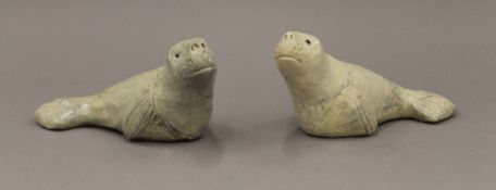 Two model seals. 19 cm long.