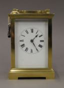 A brass cased carriage clock. 16.5 cm high.