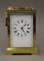 A brass cased carriage clock. 16.5 cm high.