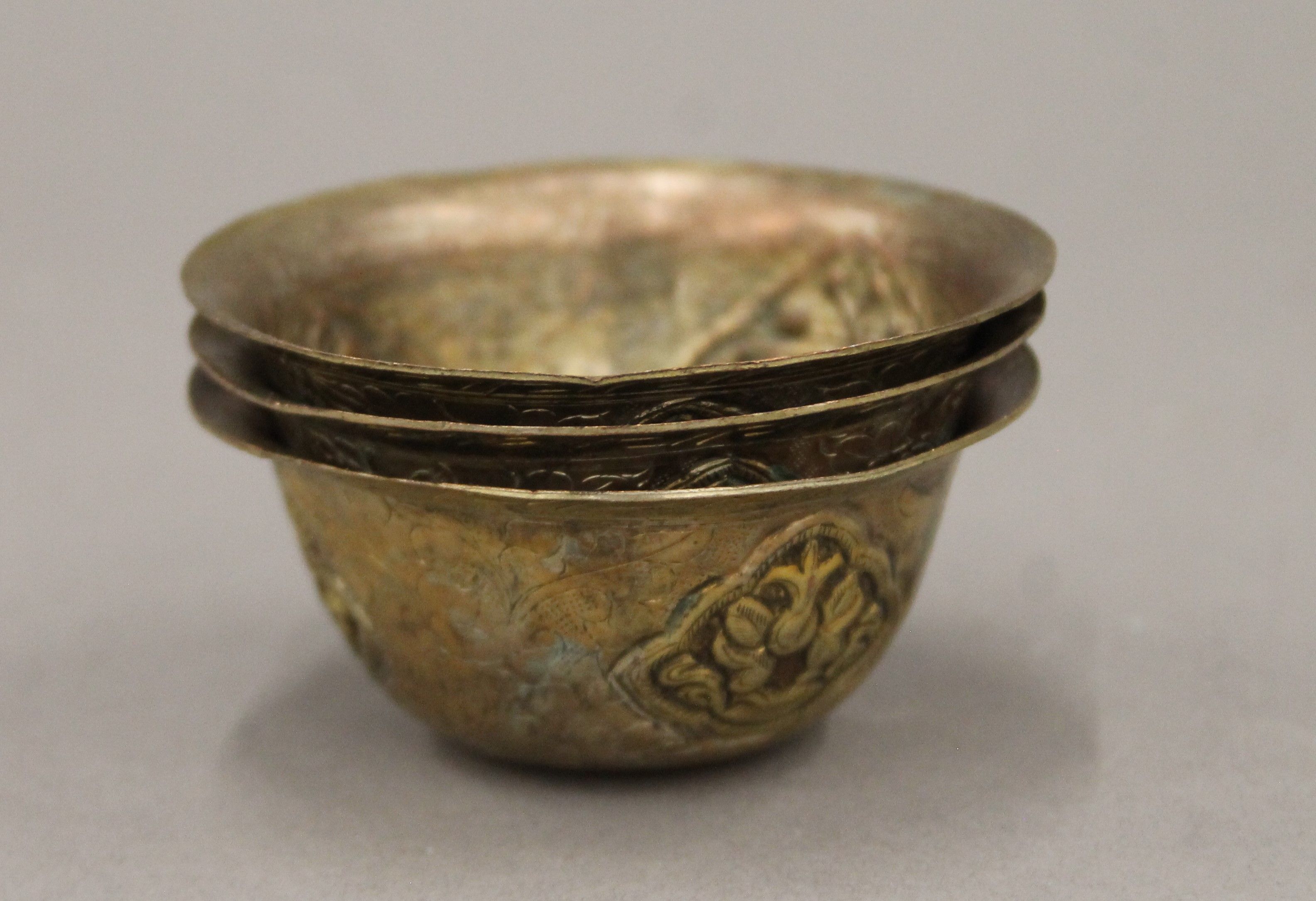 Three 19th century Tibetan bowls. 7 cm diameter.