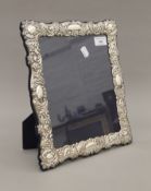 An ornate silver photograph frame. 26.5 x 31.5 cm.