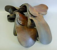 A quantity of saddles and horse tack.