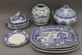 A blue and white tureen, three Willow pattern meat platters, a ginger jar, etc. The latter 22.