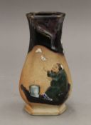 A Sumida Gawa vase decorated with a mountain and monk. 18 cm high.