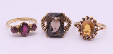 Three 9 ct gold rings. 8.4 grammes total weight.