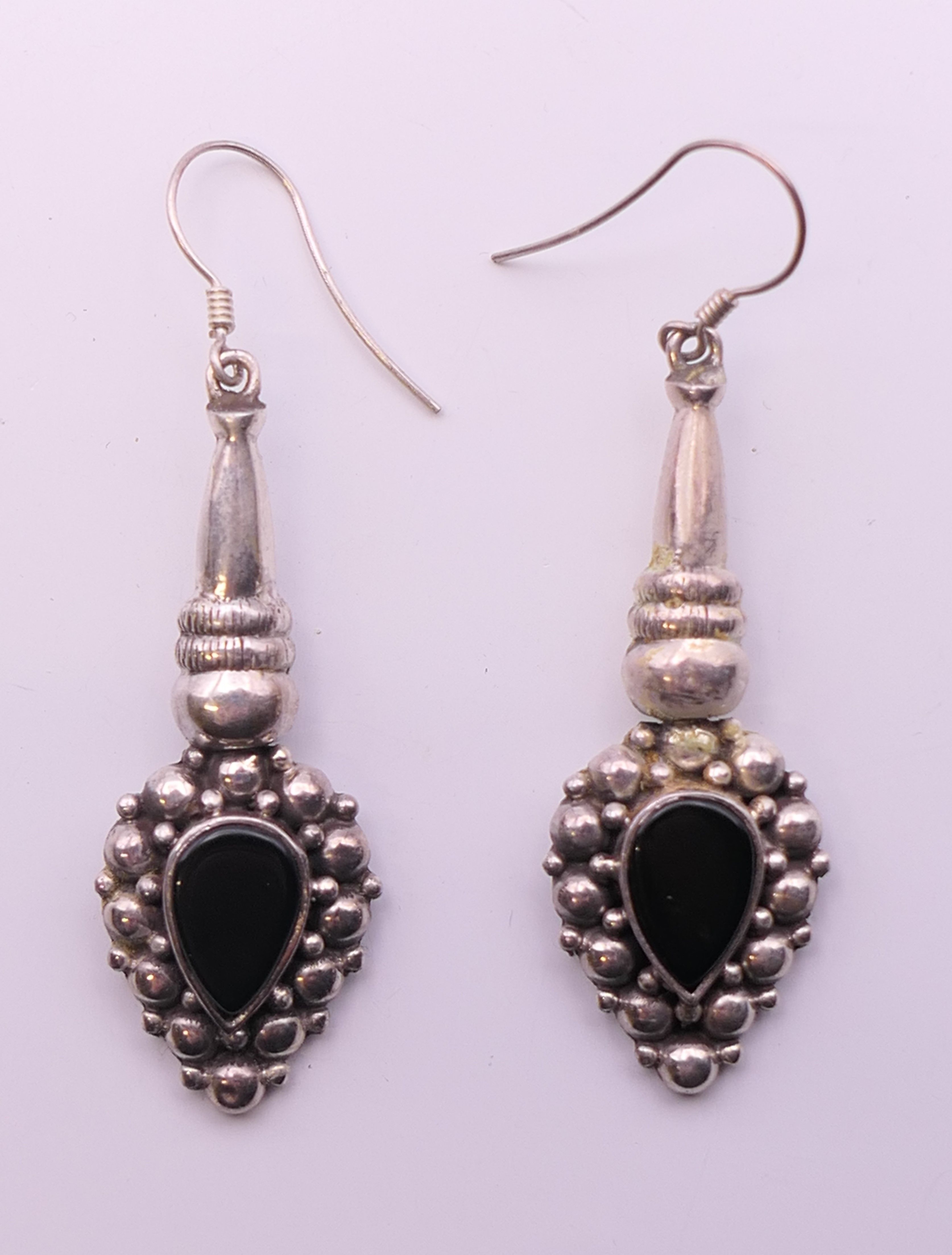 A pair of silver dress earrings. 4.5 cm high.