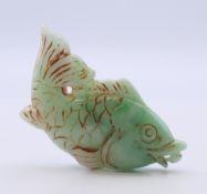 A jade fish pendant. 6 cm long.