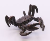 A bronze model of a crab. 5 cm wide.