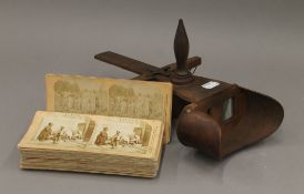 A Victorian stereoscopic viewer and various stereocards.