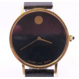 An 18 K gold Movado Zenith gentleman's wristwatch. 3.25 cm wide. 28.9 grammes total weight.