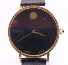 An 18 K gold Movado Zenith gentleman's wristwatch. 3.25 cm wide. 28.9 grammes total weight.