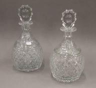 A large pair of cut crystal decanters. 34 cm high.