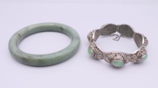 A Chinese silver and jade bracelet, and a bangle. The former approximately 17 cm long.